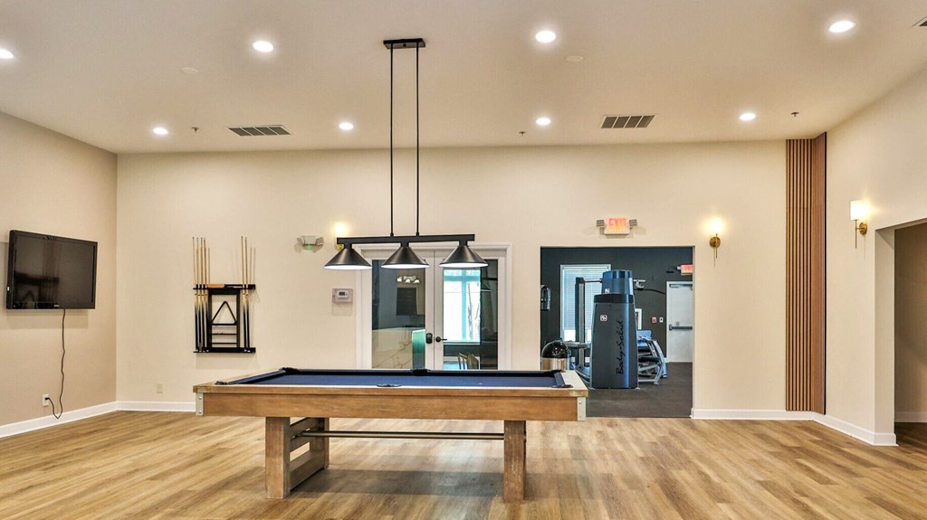the preserve at ballantyne commons clubhouse with pool table and gym
