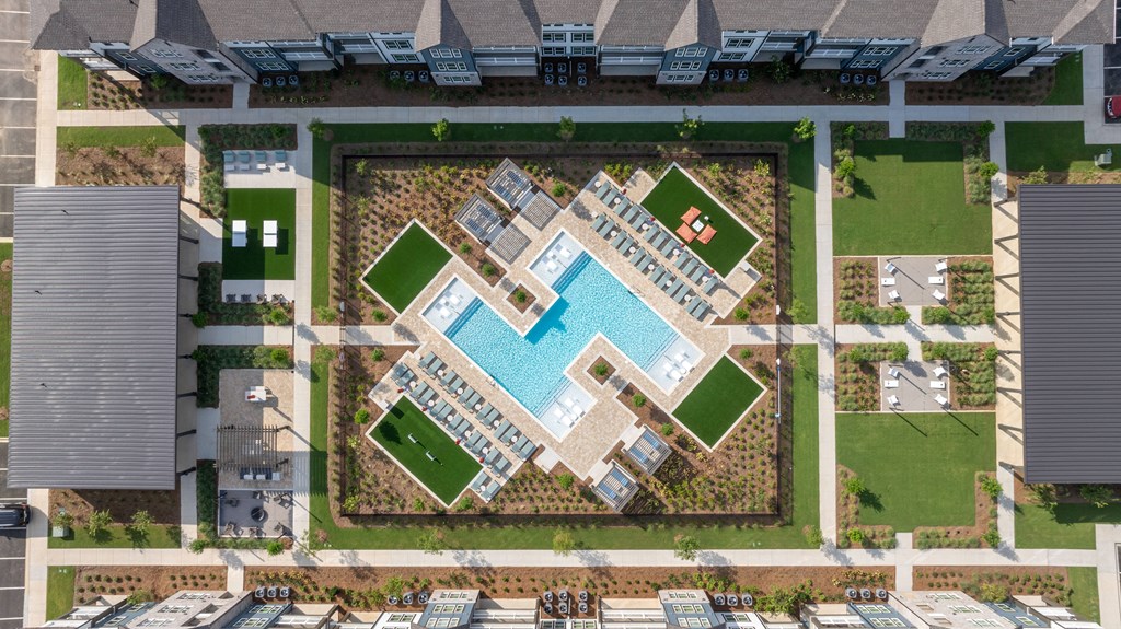 A bird's eye view of a resort with a pool and a sign that says "International Resort".