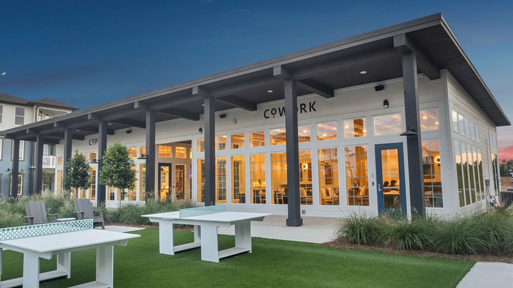 A modern building with the word "COWARD" on the front.