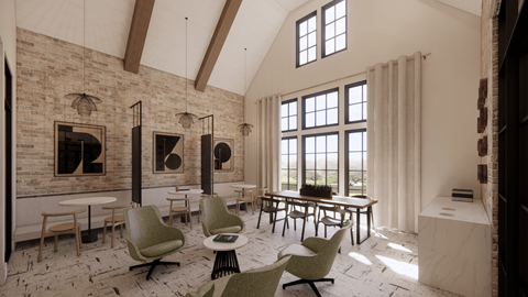 A room with a brick wall and a large table with chairs around it.