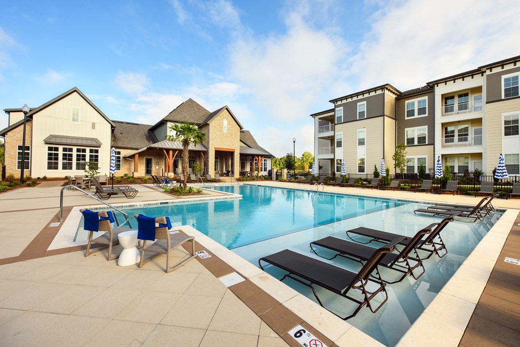our apartments have a large swimming pool with lounge chairs