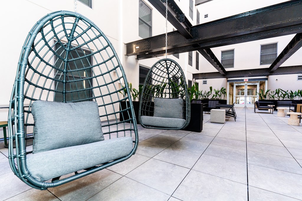 a hanging hammock chair in the lobby of a building