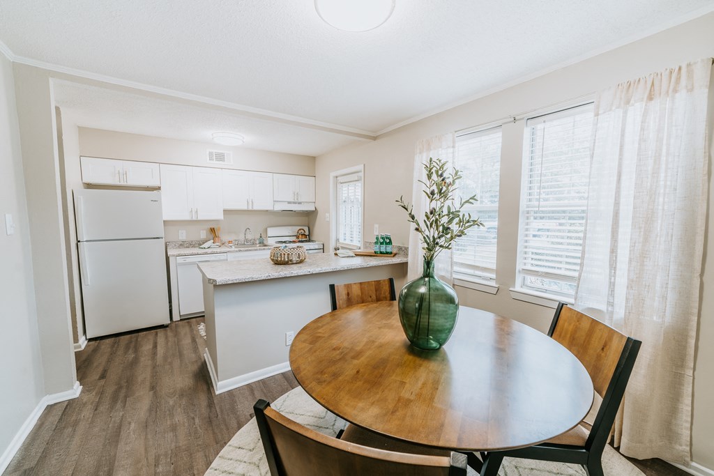 white kitchen with stone countertops at Midtown Oaks Townhomes in Mobile, AL