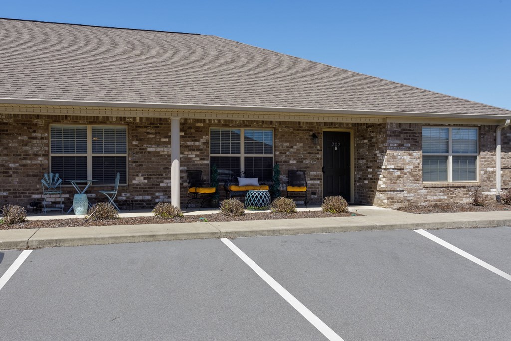 front porch and parking lot at Deerfield Apartments in Florence, AL