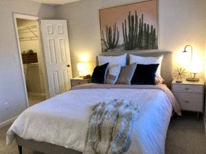 a bedroom with a large bed and a closet