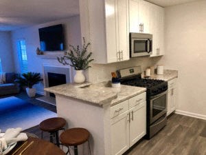 a kitchen with an island and a stove and a microwave