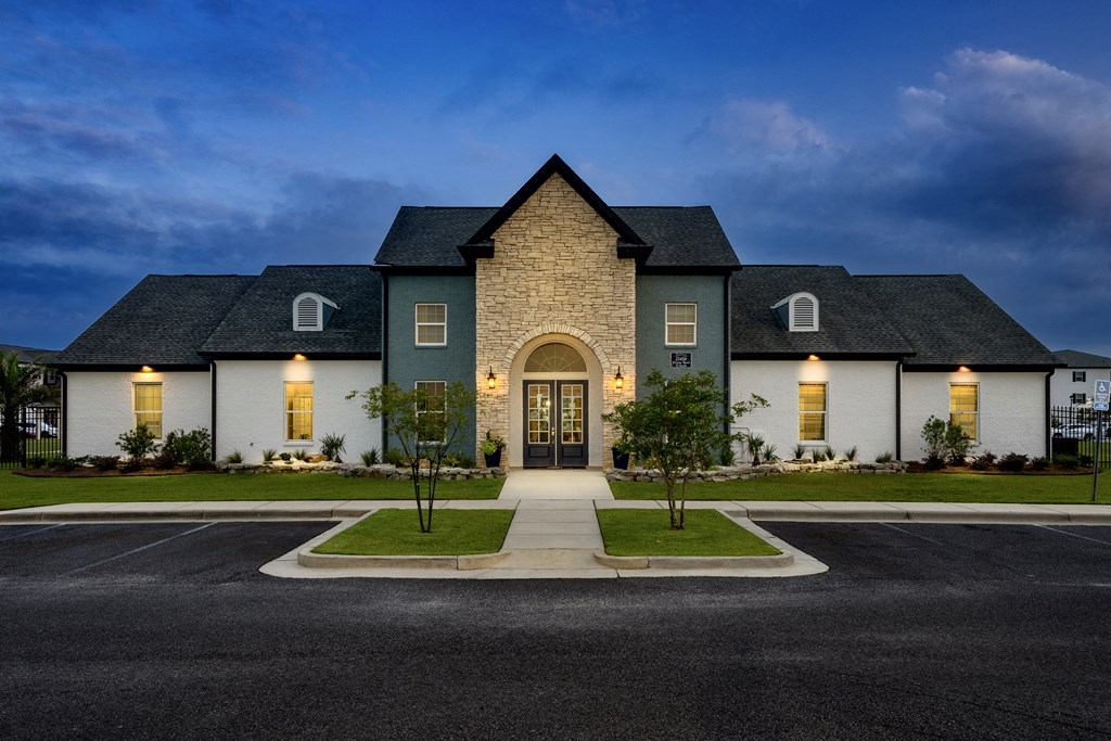 a house with a dark blue sky in the background