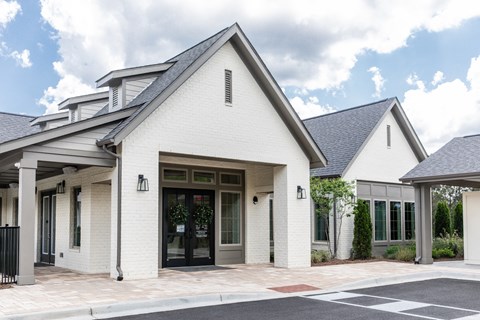 the front entrance of a white church building