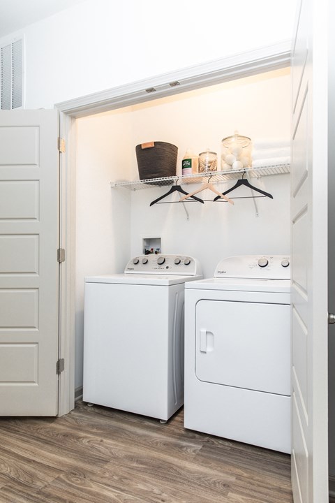 a small laundry room with a washer and dryer