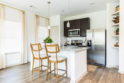 Kitchen with island at Easterwood Apartments in Gardendale, AL