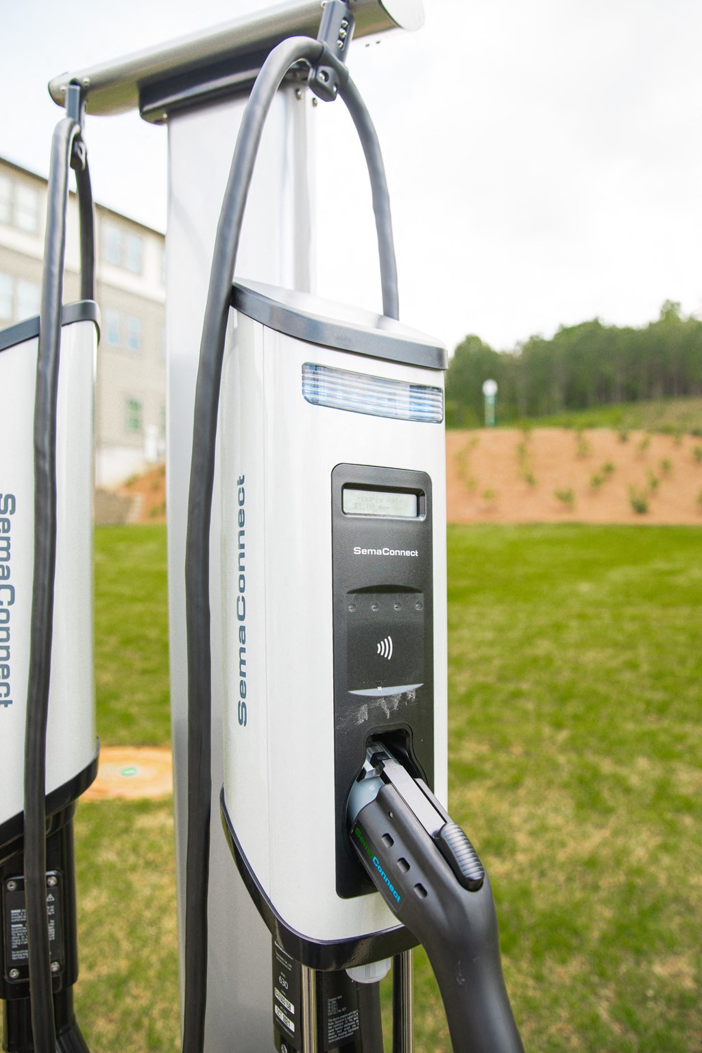 an electric charger is plugged into a power station