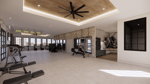 A gym with a variety of equipment including weights and a bench press.