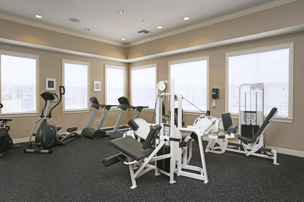 a gym with a variety of exercise equipment in it