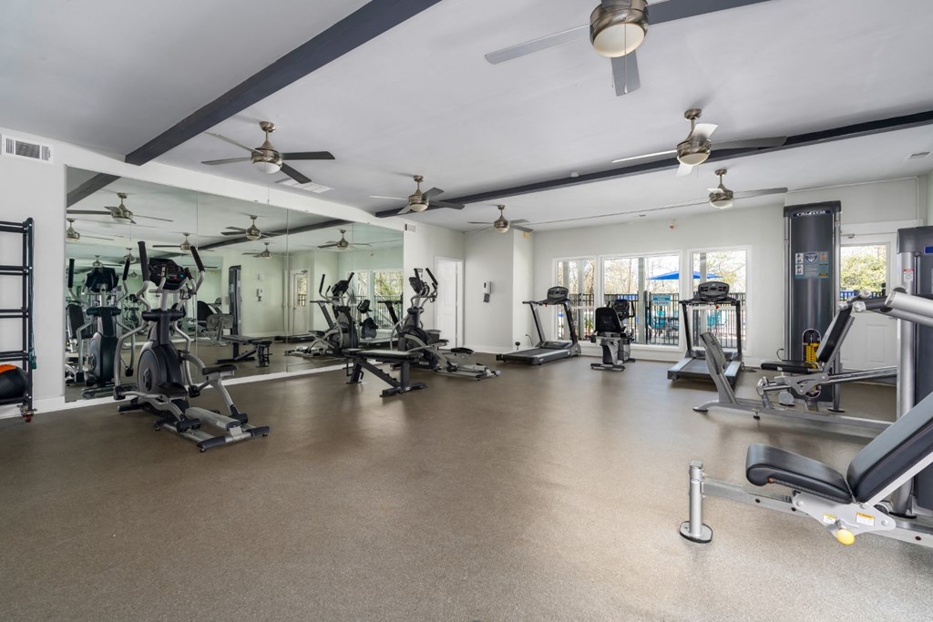 Fitness center with ceiling fans and natural light at Summerchase at Riverchase in Hoover, Alabama