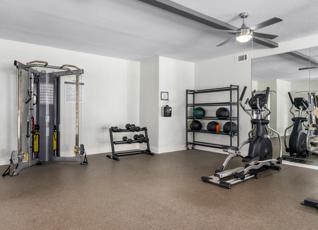 Fitness center with exercise equipment and ceiling fans at Summerchase at Riverchase in Hoover, Alabama