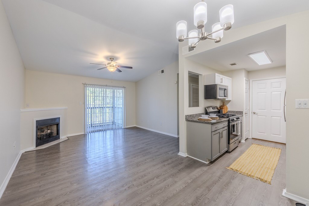 Two bedroom apartment with wood-style flooring and gas fireplace. two bedroom floor plan at Grande View Apartments in Biloxi, MS