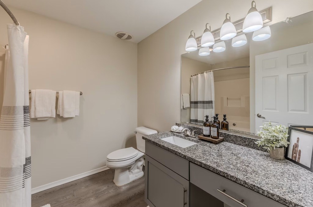 Bathroom with granite countertop and undermount sink at Grande View Apartments in Biloxi, MS