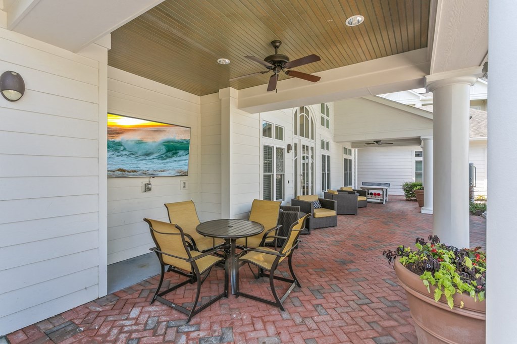 Outdoor patio with tables and chairs  at Hampton Roads Crossing, Suffolk, VA