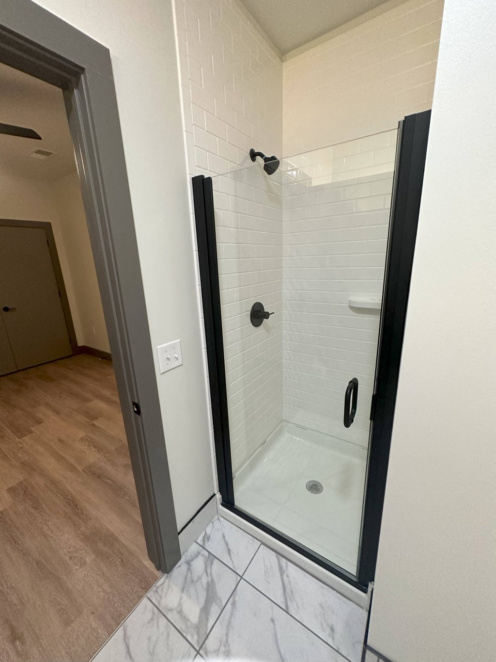 a walk in shower in a 555 waverly unit