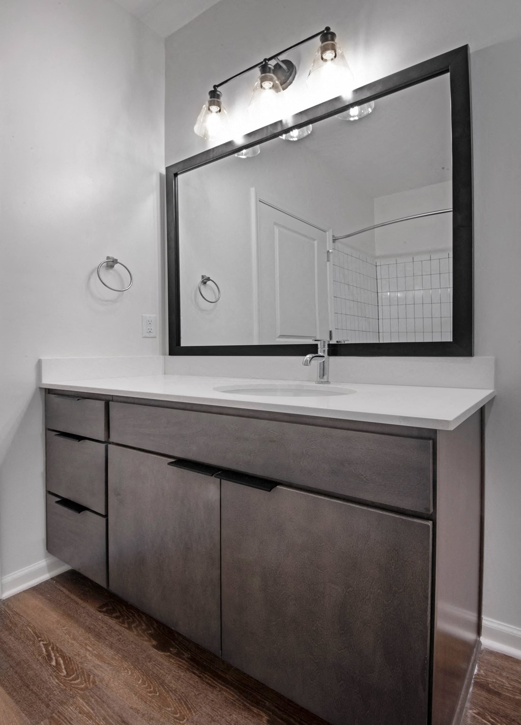 a bathroom with a sink and a mirror at Artisan Flats in Birmingham, AL