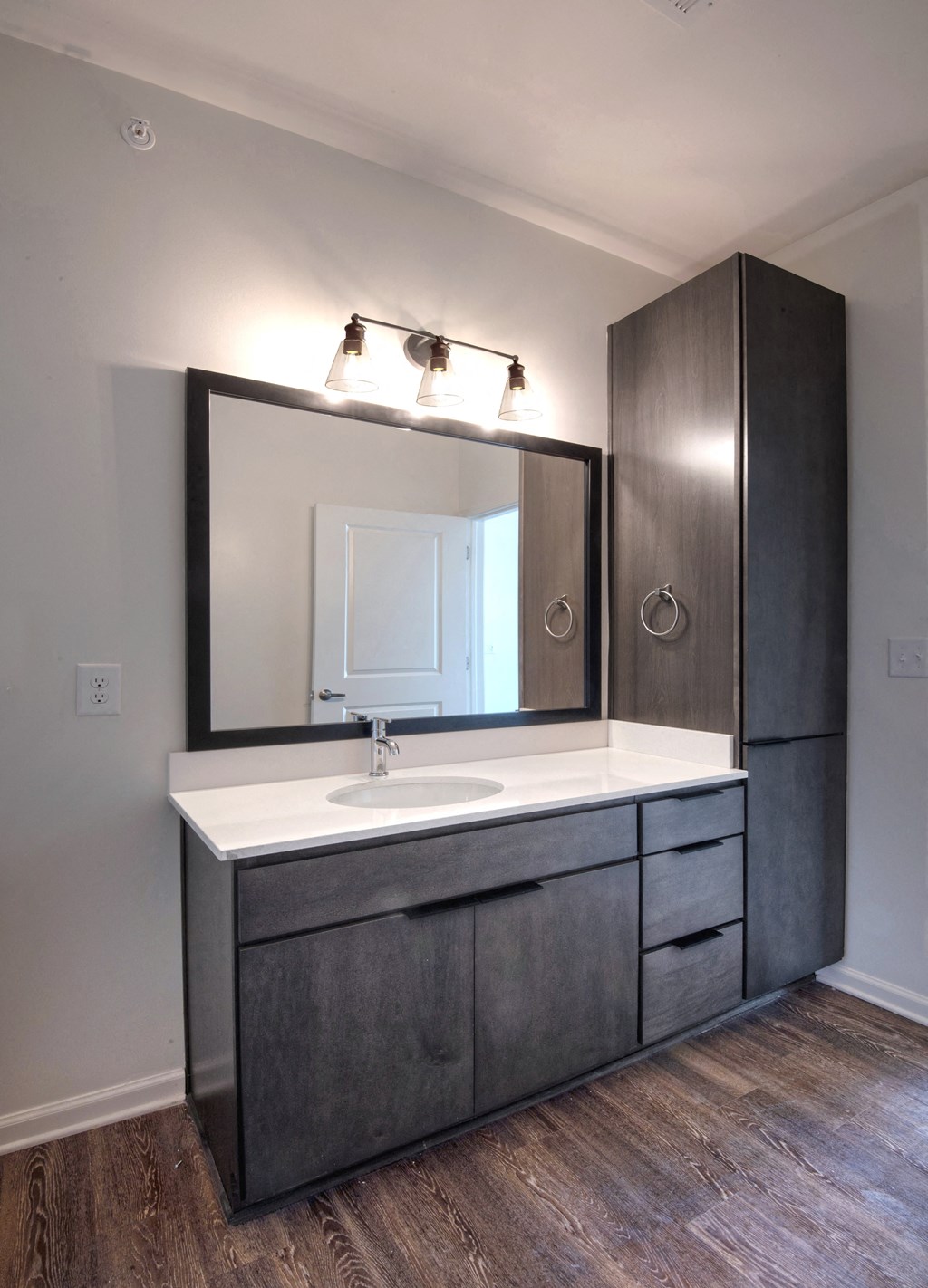 an empty bathroom with a sink and a mirror at Artisan Flats in Birmingham, AL