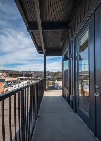 a view of the city from a balcony of a building at Artisan Flats in Birmingham, AL
