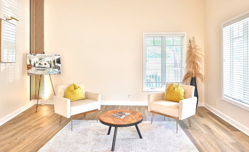 a living room with two chairs and a coffee table