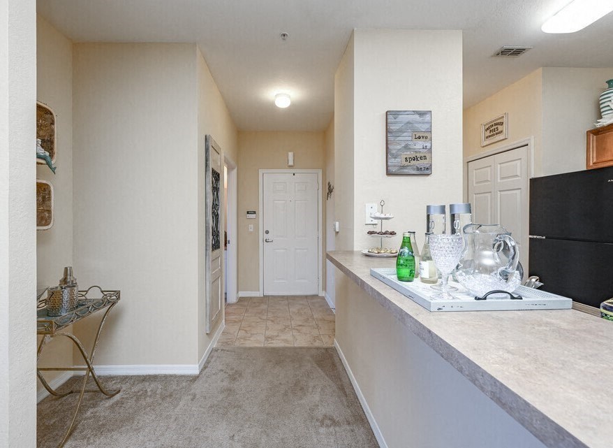 a kitchen with a counter top and a refrigerator