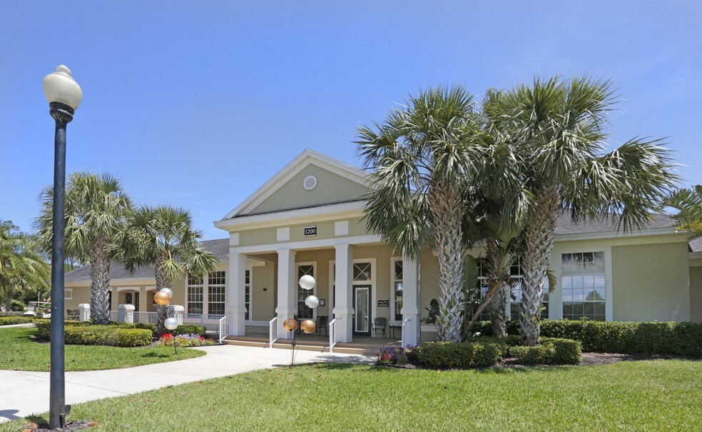 a house with palm trees in front of it