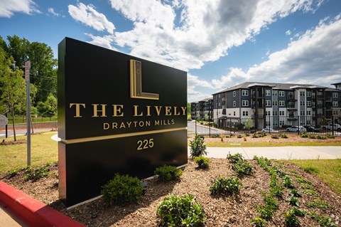 A sign for The Lively Drayton Mills reads 225.