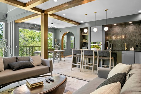 A modern living room with a large couch and a coffee table.