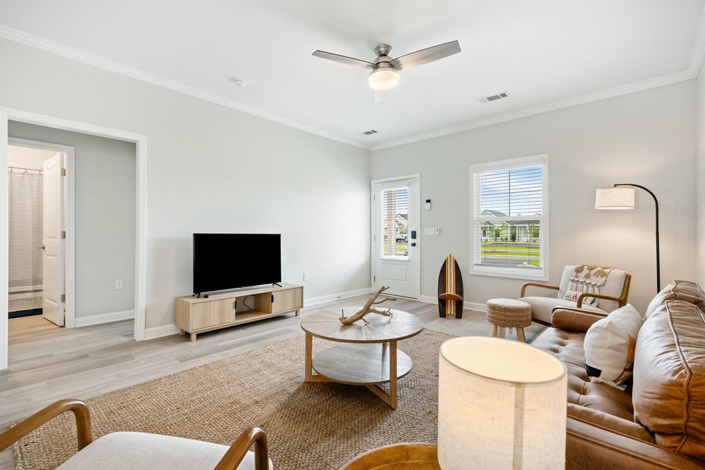 a living room with a couch and a tv