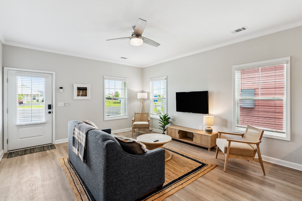 an open living room with a couch and a tv