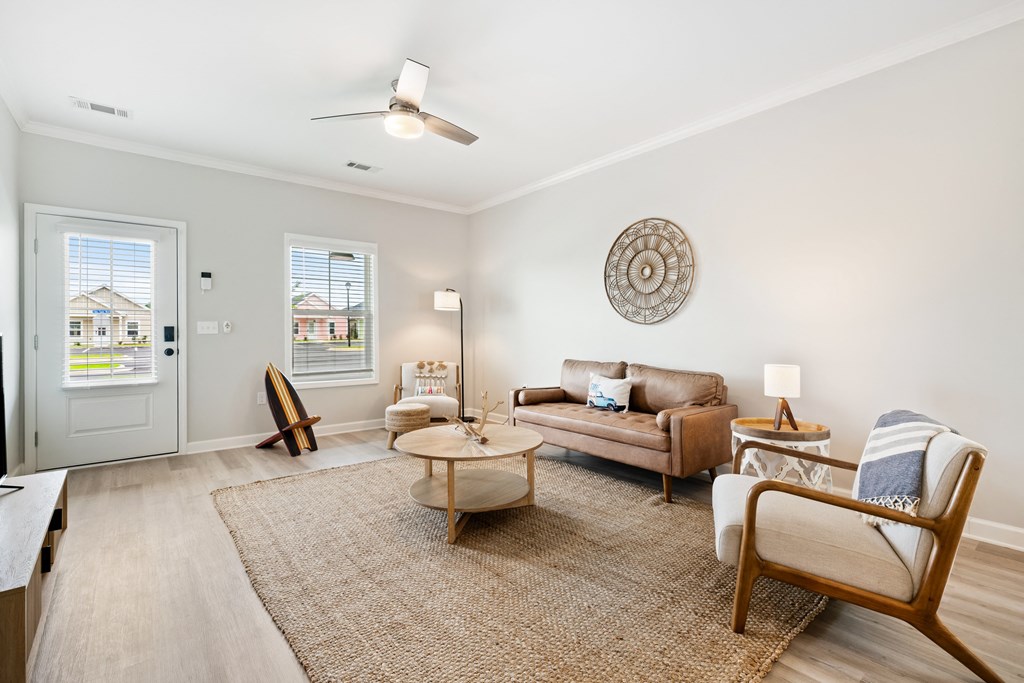 a living room with a couch and a chair and a table