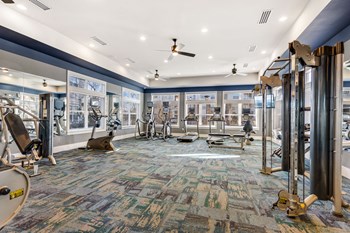 Fitness Center With Cardio and Resistance Equipment at Hampton Roads Crossing Apartments in Suffolk, VA Fitness Center With Modern Equipment at Hampton Roads Crossing, Suffolk - Photo Gallery 3