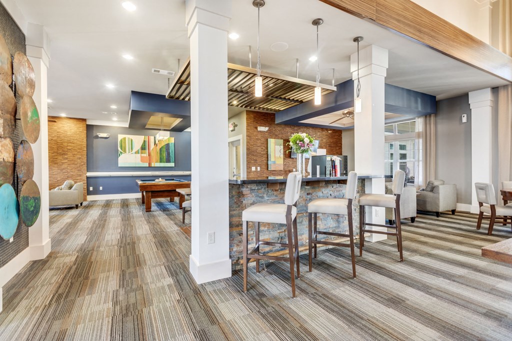 Resident Lounge With Bar Stools and Billiards In Clubhouse at Hampton Roads Crossing, Suffolk, VA, 23435