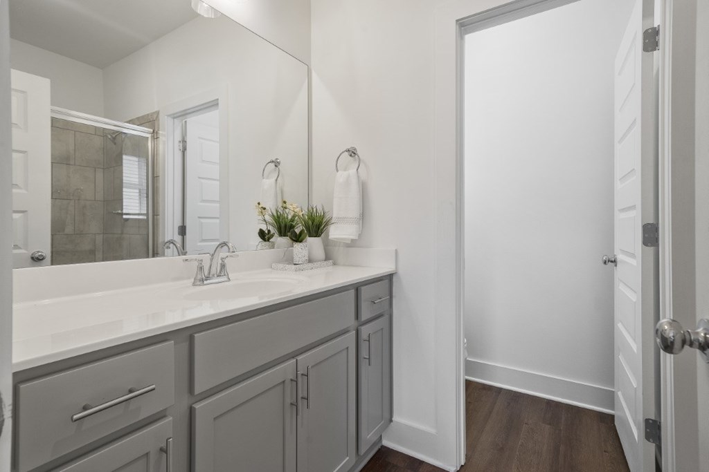 A bathroom with a quartz countertop and sink Turnberry Park Luxury Rental Homes in Gardendale, AL
