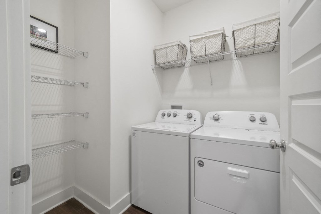 A laundry room with a washer and dryer at Turnberry Park Luxury Rental Homes in Gardendale, AL