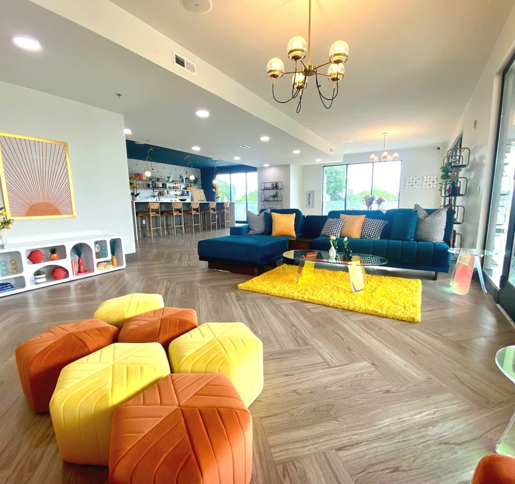 a living room filled with furniture and a chandelier