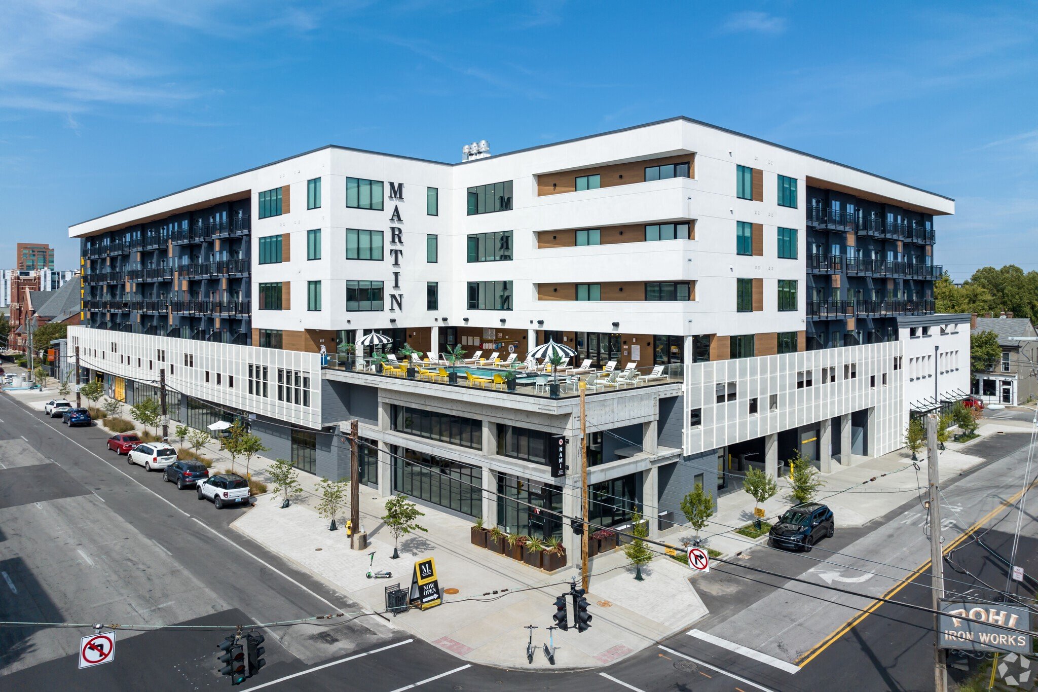 an aerial view of a large white building on a city street