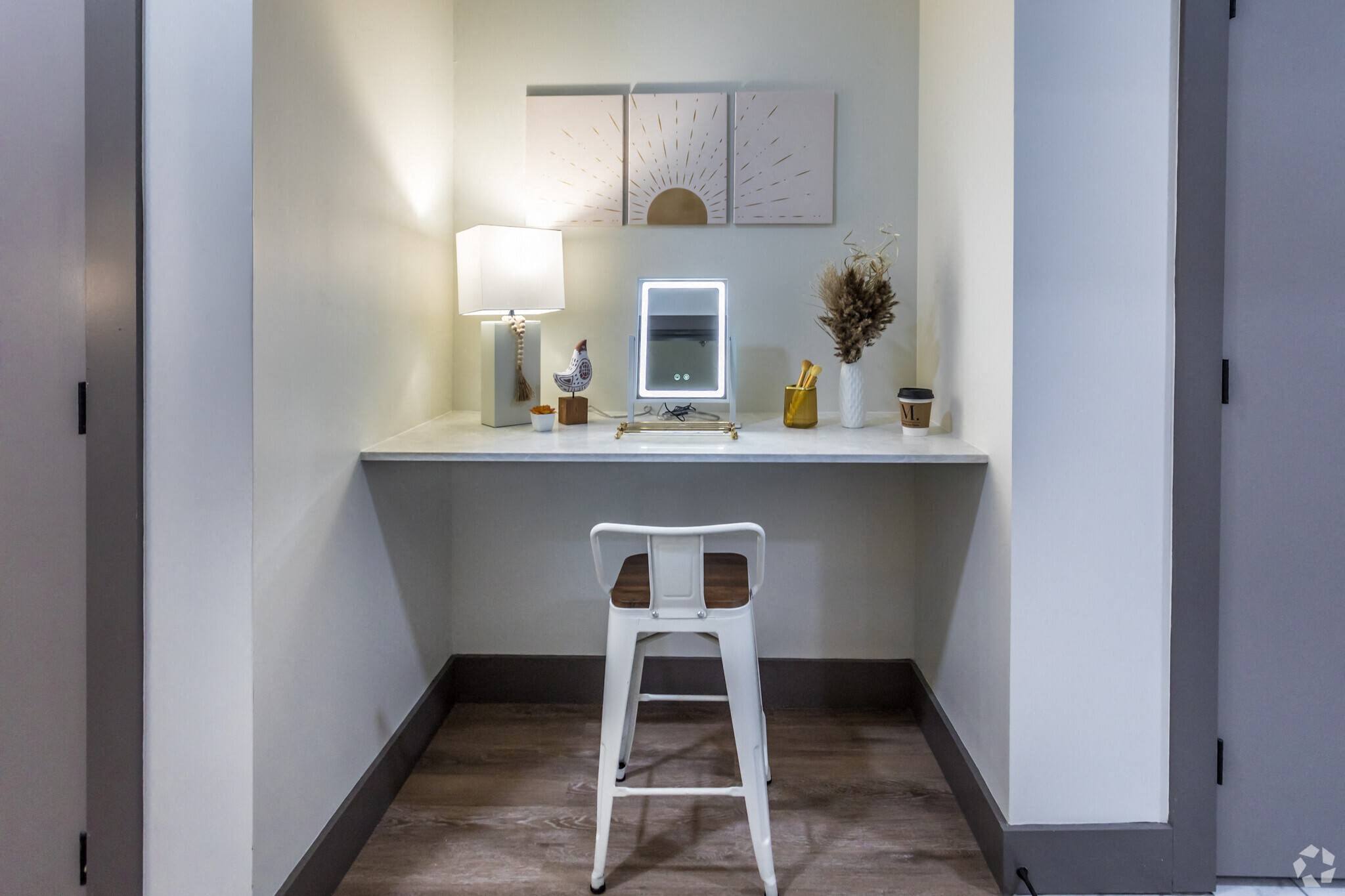 a small desk with a chair and a computer
