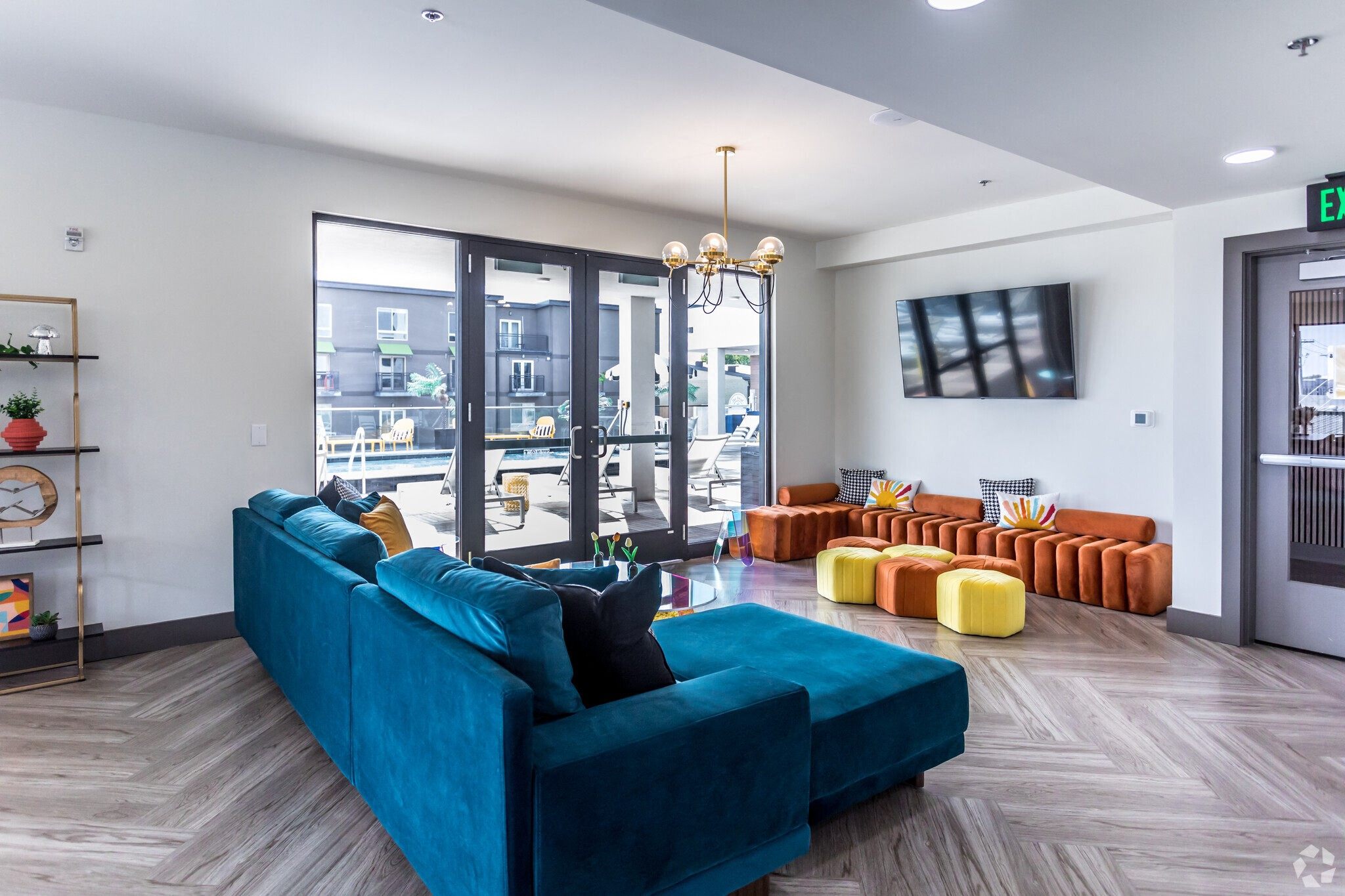 a living room with a blue couch and a tv