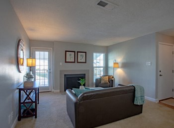 Living Room With Fireplace Living Room With Fireplace at Mirabelle Apartments, Mobile - Photo Gallery 5