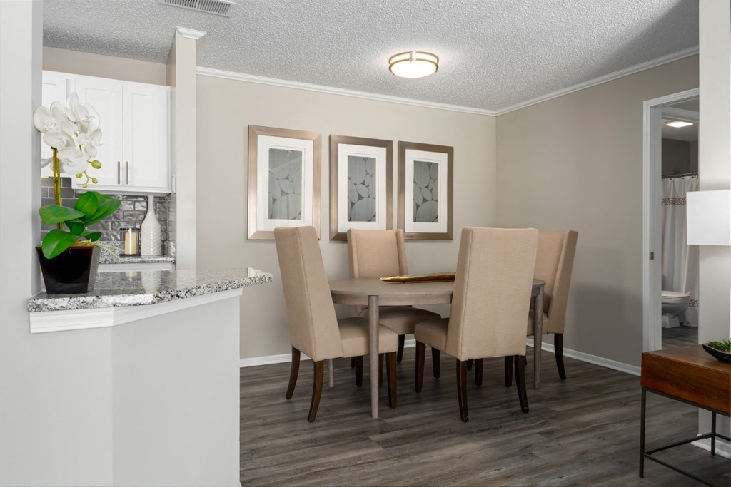 A dining room with wood-look flooring at Summerchase at Riverchase in Hoover, AL