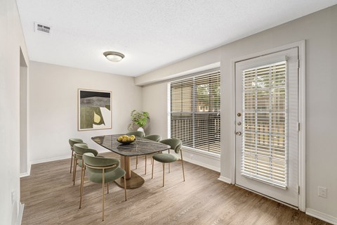 Large dining area in the model with staged six seater dining table at Oakley at Hillcrest