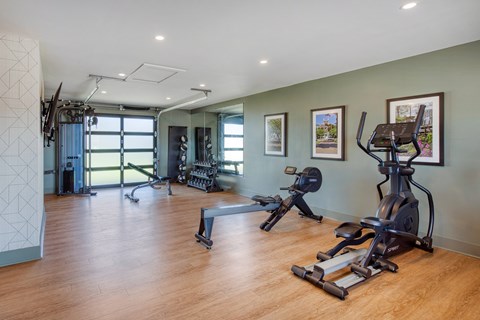 A spacious gym with a variety of exercise equipment.