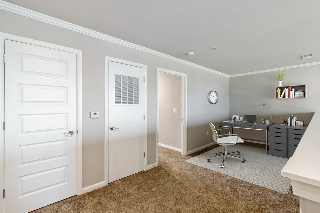 a home office with a desk and chair
