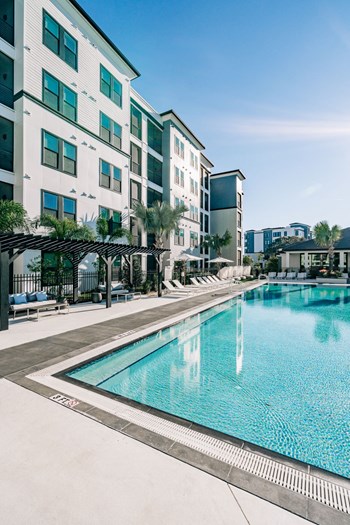 Heated Resort Pool Apartment complex swimming pool with outdoor lounge area at The Pointe on Westshore in Tampa, FL - Photo Gallery 3