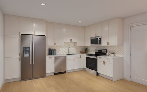 A kitchen with white cabinets and a stainless steel refrigerator.