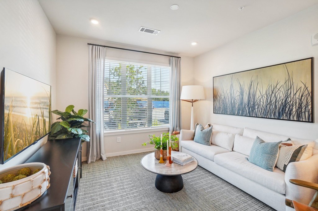 a living room with a couch and a table